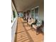 Spacious front porch with wicker furniture, perfect for relaxing at 710 Lakeside Dr., Surfside Beach, SC 29575