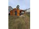 Detached workshop with covered patio, offering extra storage space at 710 Lakeside Dr., Surfside Beach, SC 29575