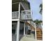 Exterior stair lift providing convenient access to the second floor at 710 Lakeside Dr., Surfside Beach, SC 29575
