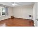 Spacious bedroom with hardwood floors and a large window at 4255 Villas Dr. # 201, Little River, SC 29566