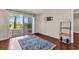 Hardwood floor living room with sliding glass doors and patio access at 4255 Villas Dr. # 201, Little River, SC 29566