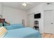 Two twin beds, ceiling fan, and wood flooring in bedroom at 1551 Spinnaker Dr. # 5822, North Myrtle Beach, SC 29582