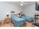 Two twin beds, ceiling fan, and wood flooring in bedroom at 1551 Spinnaker Dr. # 5822, North Myrtle Beach, SC 29582