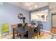Bright dining room with black table and green chairs, open to kitchen at 1551 Spinnaker Dr. # 5822, North Myrtle Beach, SC 29582