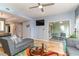 Living room with sectional sofa, TV, and access to a screened porch at 1551 Spinnaker Dr. # 5822, North Myrtle Beach, SC 29582