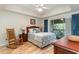 Bright bedroom with a queen bed, rocking chair, and access to a balcony at 1551 Spinnaker Dr. # 5822, North Myrtle Beach, SC 29582
