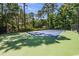 Well-maintained tennis court surrounded by lush greenery at 1551 Spinnaker Dr. # 5822, North Myrtle Beach, SC 29582