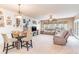 Living room with comfortable seating, large TV, and access to balcony at 5056 Glenbrook Dr. # 202, Myrtle Beach, SC 29579