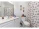 Clean bathroom with white vanity, seashell shower curtain, and toilet at 5056 Glenbrook Dr. # 202, Myrtle Beach, SC 29579