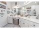 Double vanity bathroom with white cabinets and a corner sink at 5056 Glenbrook Dr. # 202, Myrtle Beach, SC 29579