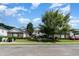 Two-story brick building with walkway and landscaping at 5056 Glenbrook Dr. # 202, Myrtle Beach, SC 29579