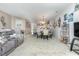 Open living room features a neutral color palette and includes views into the kitchen and dining area at 5056 Glenbrook Dr. # 202, Myrtle Beach, SC 29579