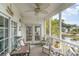 Spacious screened porch with outdoor seating and pond views at 5056 Glenbrook Dr. # 202, Myrtle Beach, SC 29579