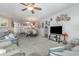 Spacious living room with ample natural light and a ceiling fan at 5056 Glenbrook Dr. # 202, Myrtle Beach, SC 29579