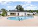 Community pool with a surrounding patio and lounge chairs at 5056 Glenbrook Dr. # 202, Myrtle Beach, SC 29579