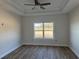 Bedroom with wood-look flooring and large window offering plenty of natural light at 4983 Dupont Rd., Aynor, SC 29511