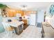 Well-equipped kitchen with light wood cabinets and white appliances at 6302 Ocean Blvd. N # E-1, North Myrtle Beach, SC 29582