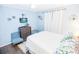 Bedroom with a double bed and sitting chair at 6302 Ocean Blvd. N # E-1, North Myrtle Beach, SC 29582