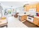 Well-equipped kitchen with light wood cabinets and white appliances at 6302 Ocean Blvd. N # E-1, North Myrtle Beach, SC 29582