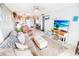 Open living room and kitchen with comfy seating and coastal decor at 6302 Ocean Blvd. N # E-1, North Myrtle Beach, SC 29582