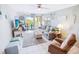 Bright living room with ocean view, comfy seating, and coastal decor at 6302 Ocean Blvd. N # E-1, North Myrtle Beach, SC 29582