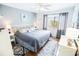 King-size bed, wood floors, and coastal decor at 6302 Ocean Blvd. N # E-1, North Myrtle Beach, SC 29582