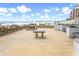 Shared patio area with picnic tables and benches at 6302 Ocean Blvd. N # E-1, North Myrtle Beach, SC 29582