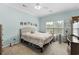 Spacious bedroom with a large bed, plenty of natural light, and carpeted floors at 5882 Longwood Dr. # 204, Murrells Inlet, SC 29576