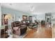 Relaxing living room with hardwood floors, comfortable recliner and view of dining area at 5882 Longwood Dr. # 204, Murrells Inlet, SC 29576