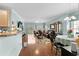 Open floor plan with hardwood floors, leather furniture and dining area at 5882 Longwood Dr. # 204, Murrells Inlet, SC 29576