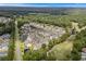 Aerial view of community, highlighting the location of the condo building amongst others at 5882 Longwood Dr. # 204, Murrells Inlet, SC 29576