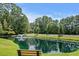 Enjoy the tranquil pond view from this peaceful community setting at 5882 Longwood Dr. # 204, Murrells Inlet, SC 29576
