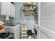 Convenient laundry room with washer, dryer, and extra storage at 5882 Longwood Dr. # 204, Murrells Inlet, SC 29576