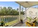 Enjoy the view from this screened porch overlooking a pond at 5882 Longwood Dr. # 204, Murrells Inlet, SC 29576