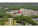 Aerial view of a condo community with a pond and surrounding trees at 5882 Longwood Dr. # 204, Murrells Inlet, SC 29576