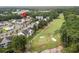 Aerial view of a condo community near a golf course and pond at 5882 Longwood Dr. # 204, Murrells Inlet, SC 29576