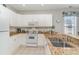 Well-equipped kitchen featuring white cabinets, granite countertops, and stainless steel appliances at 1009 World Tour Blvd. # 301, Myrtle Beach, SC 29579