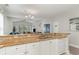 Kitchen with granite countertops, white cabinets, and views into the living room at 1009 World Tour Blvd. # 301, Myrtle Beach, SC 29579