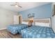 Bedroom with two twin beds, a ceiling fan, and light blue walls at 1009 World Tour Blvd. # 301, Myrtle Beach, SC 29579