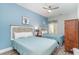Bedroom with two twin beds, a ceiling fan, and light blue walls at 1009 World Tour Blvd. # 301, Myrtle Beach, SC 29579