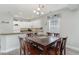Dining area with a dark wood table and six chairs, located near the kitchen at 1009 World Tour Blvd. # 301, Myrtle Beach, SC 29579
