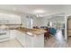 Open concept kitchen with granite island, looking into dining and living areas at 1009 World Tour Blvd. # 301, Myrtle Beach, SC 29579