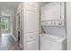 Stackable washer and dryer in a small laundry closet at 1009 World Tour Blvd. # 301, Myrtle Beach, SC 29579