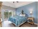 Bedroom with a queen bed, access to a balcony, and light blue walls at 1009 World Tour Blvd. # 301, Myrtle Beach, SC 29579