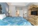 Main bedroom with a queen bed, en-suite bathroom access, and built-in media cabinet at 1009 World Tour Blvd. # 301, Myrtle Beach, SC 29579