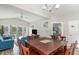 Open dining area with a wood table and chairs, adjacent to living room and kitchen at 1009 World Tour Blvd. # 301, Myrtle Beach, SC 29579