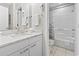 Bathroom with single vanity, granite countertop, and shower/tub combo at 110 Hartland Dr. # 15-E, Myrtle Beach, SC 29572