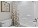 Bathroom with shower/tub combo, toilet, and seashell shower curtain at 110 Hartland Dr. # 15-E, Myrtle Beach, SC 29572