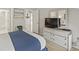 Bedroom with dresser, TV, and coastal-themed decor at 110 Hartland Dr. # 15-E, Myrtle Beach, SC 29572