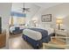 Bedroom with two beds, ceiling fan, and wood flooring at 110 Hartland Dr. # 15-E, Myrtle Beach, SC 29572
